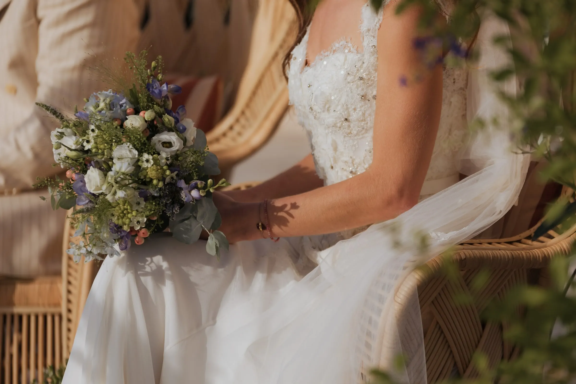 Close-up of the bride's bouquet of wild flowers in her lap during the ceremony, Barbillón, Marbella