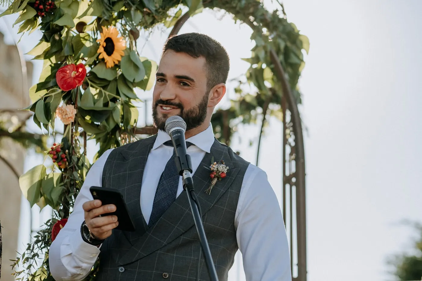 Groom reading his vows from his phone at the microphone, Salamanca
