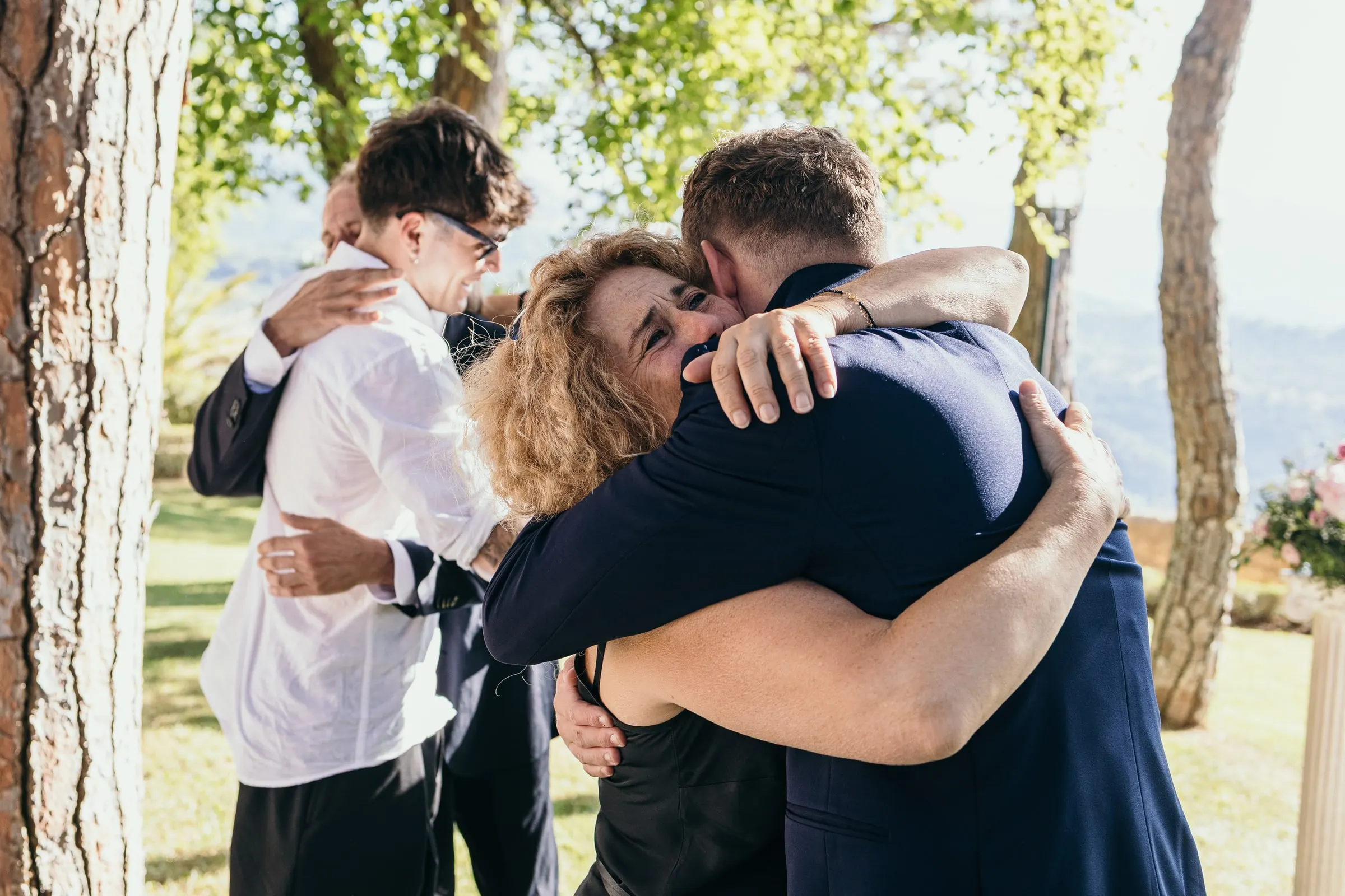 Vincent shares a long hug with a guest after the ceremony