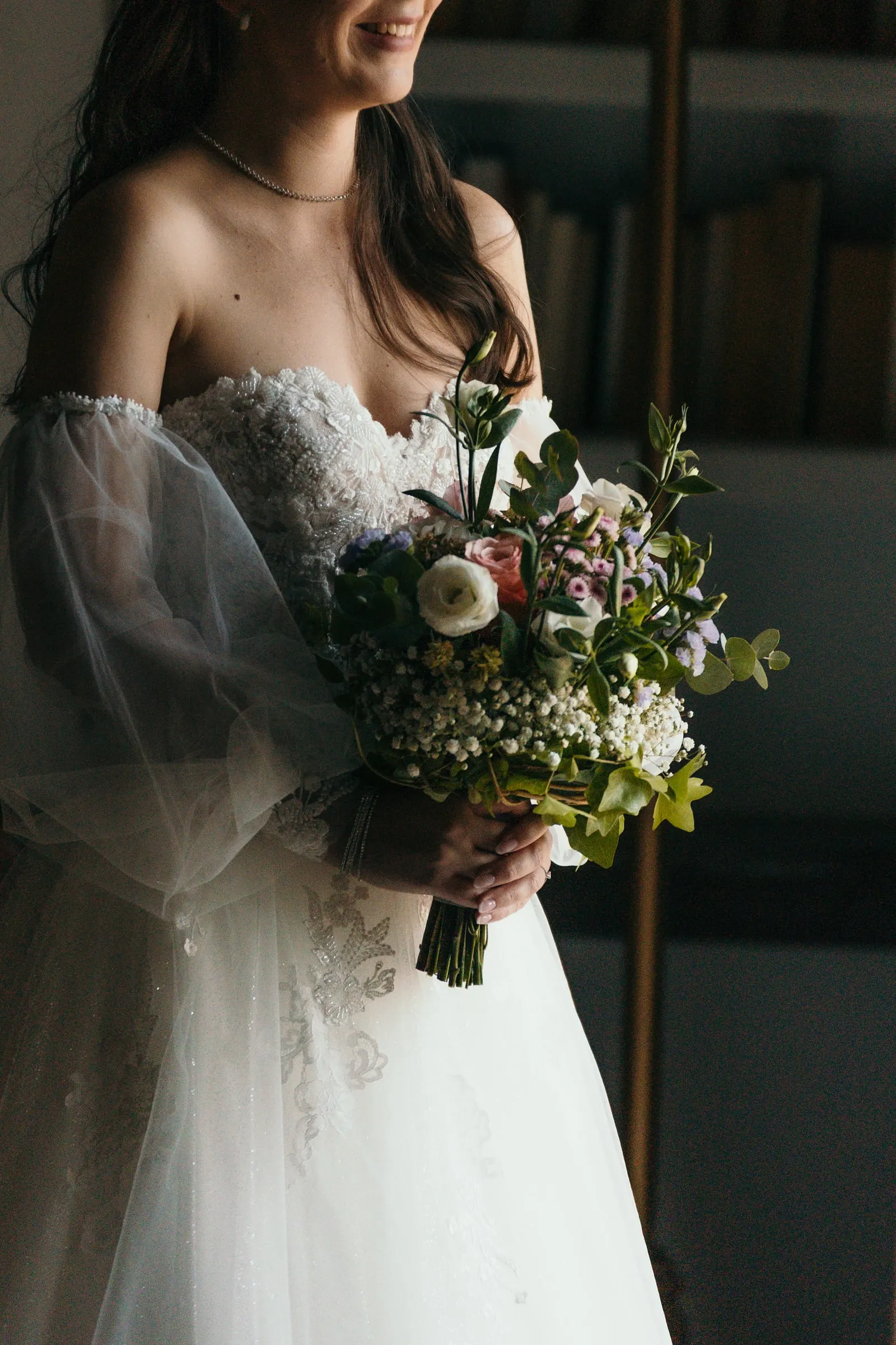 Bride smiling with her bouquet of white flowers and greenery, Cortijo San Francisco, Estepona