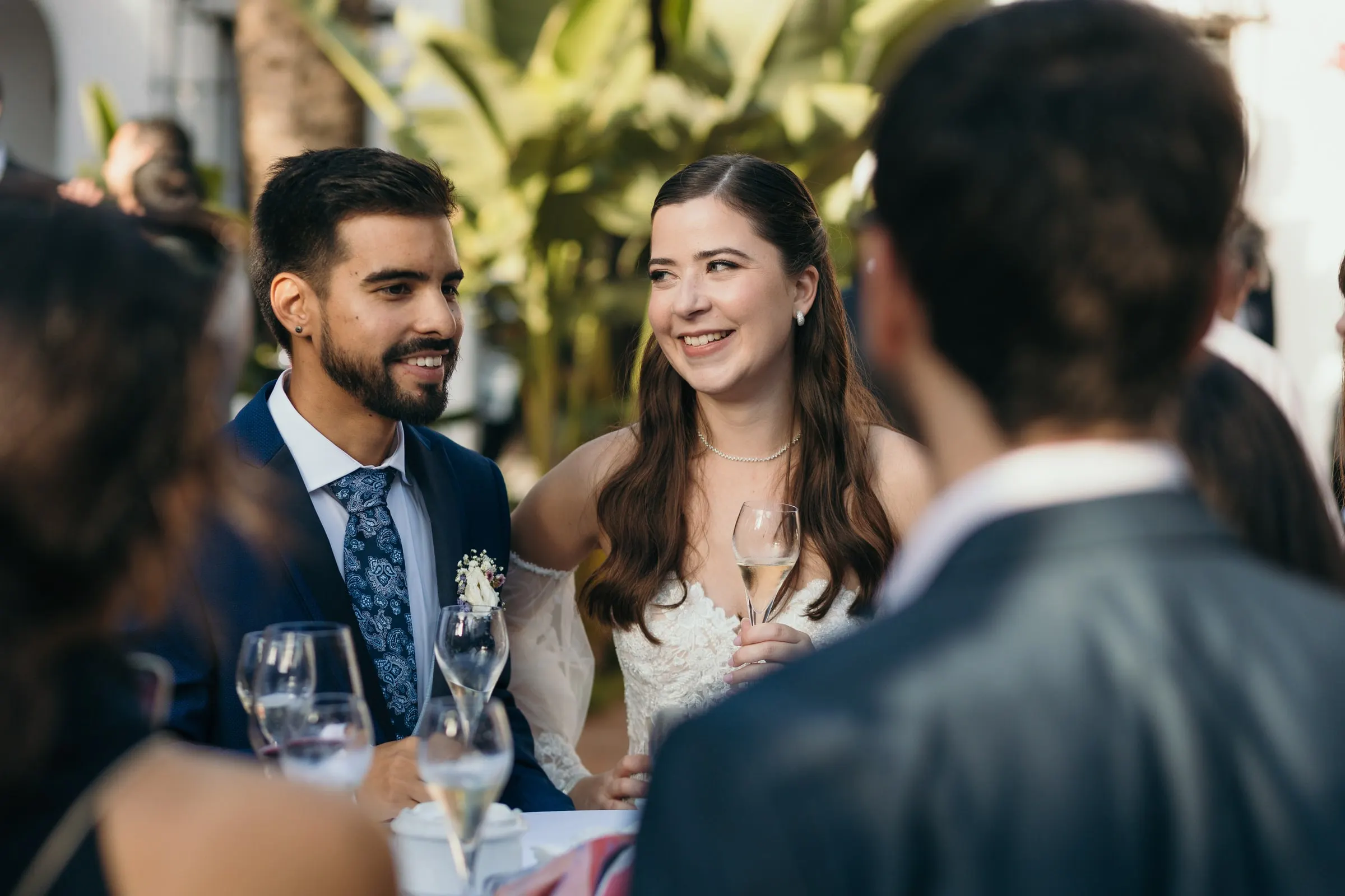 Bride and groom laughing with guests during the drinks reception, Cortijo San Francisco, Estepona