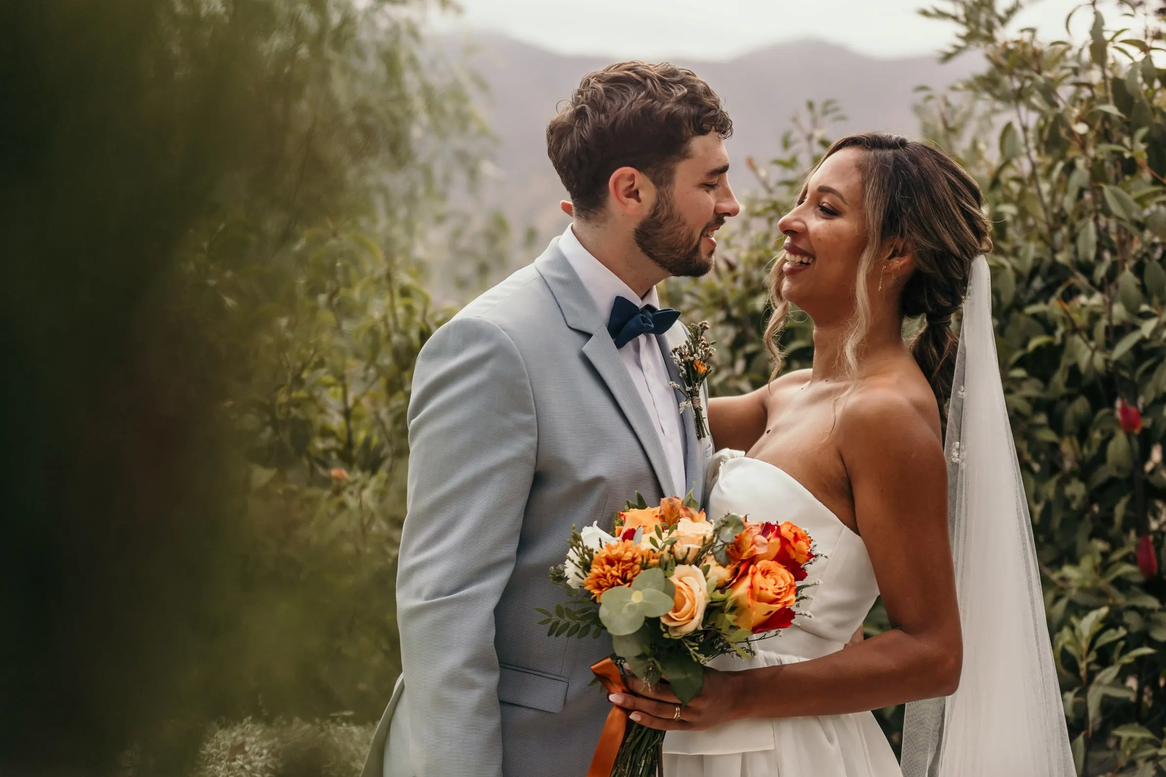 Couple portrait in the garden with the mountains of the Costa del Sol softly behind