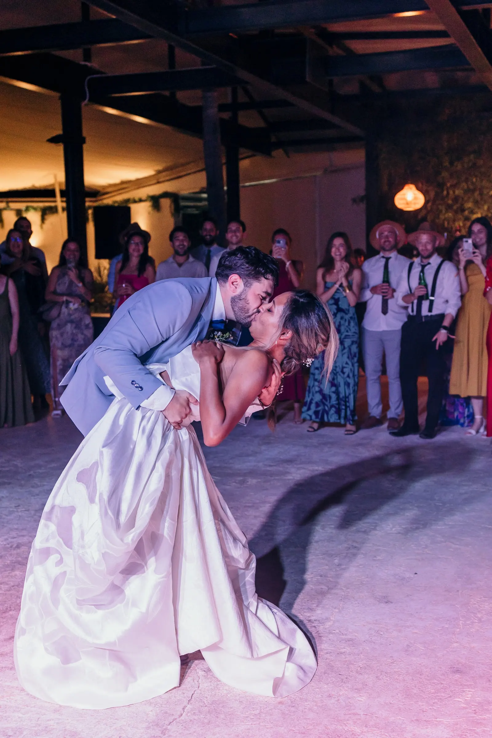 Groom dipping the bride for a kiss at the end of the first dance