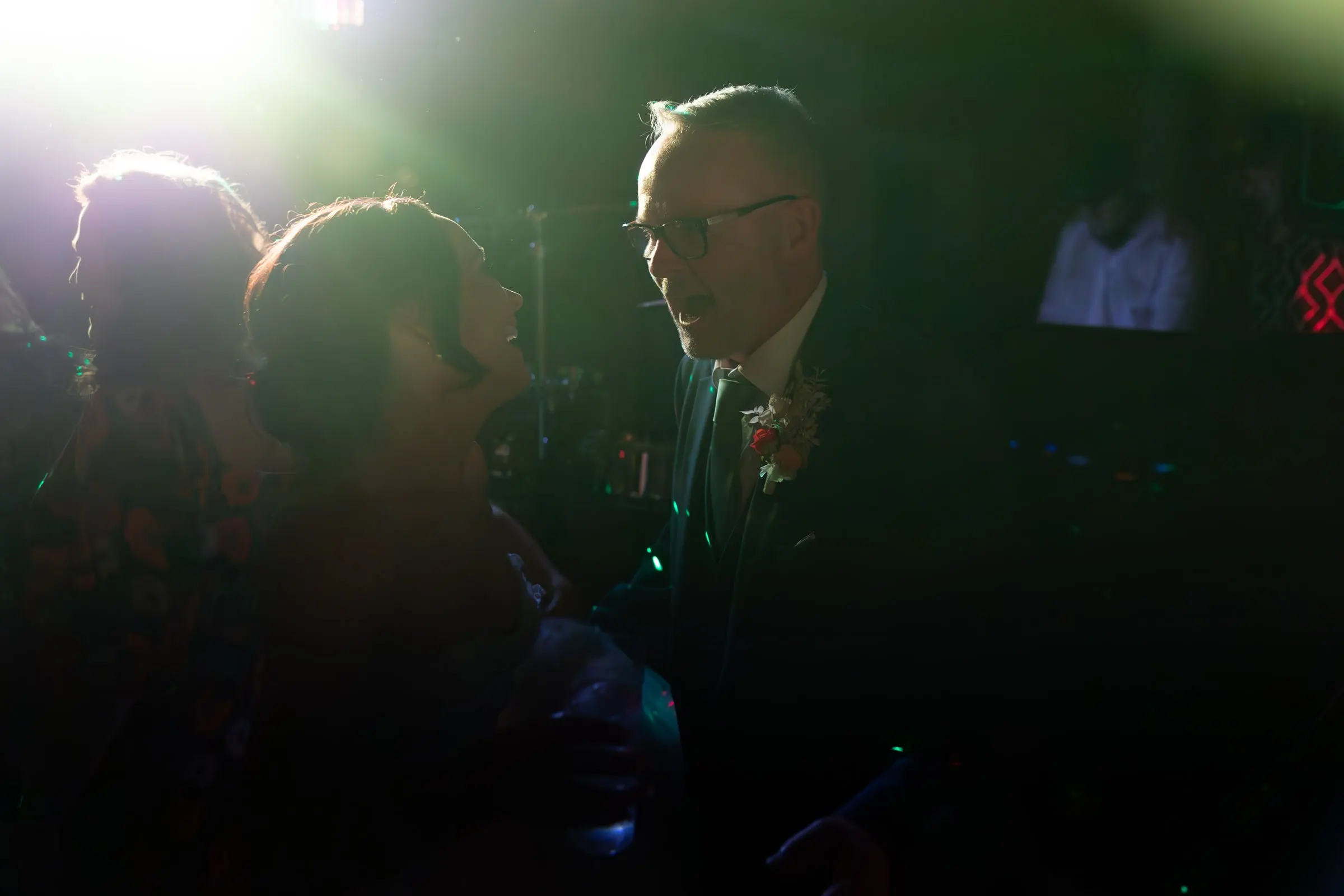 Guests dancing in the backlight of the party, Hacienda San José