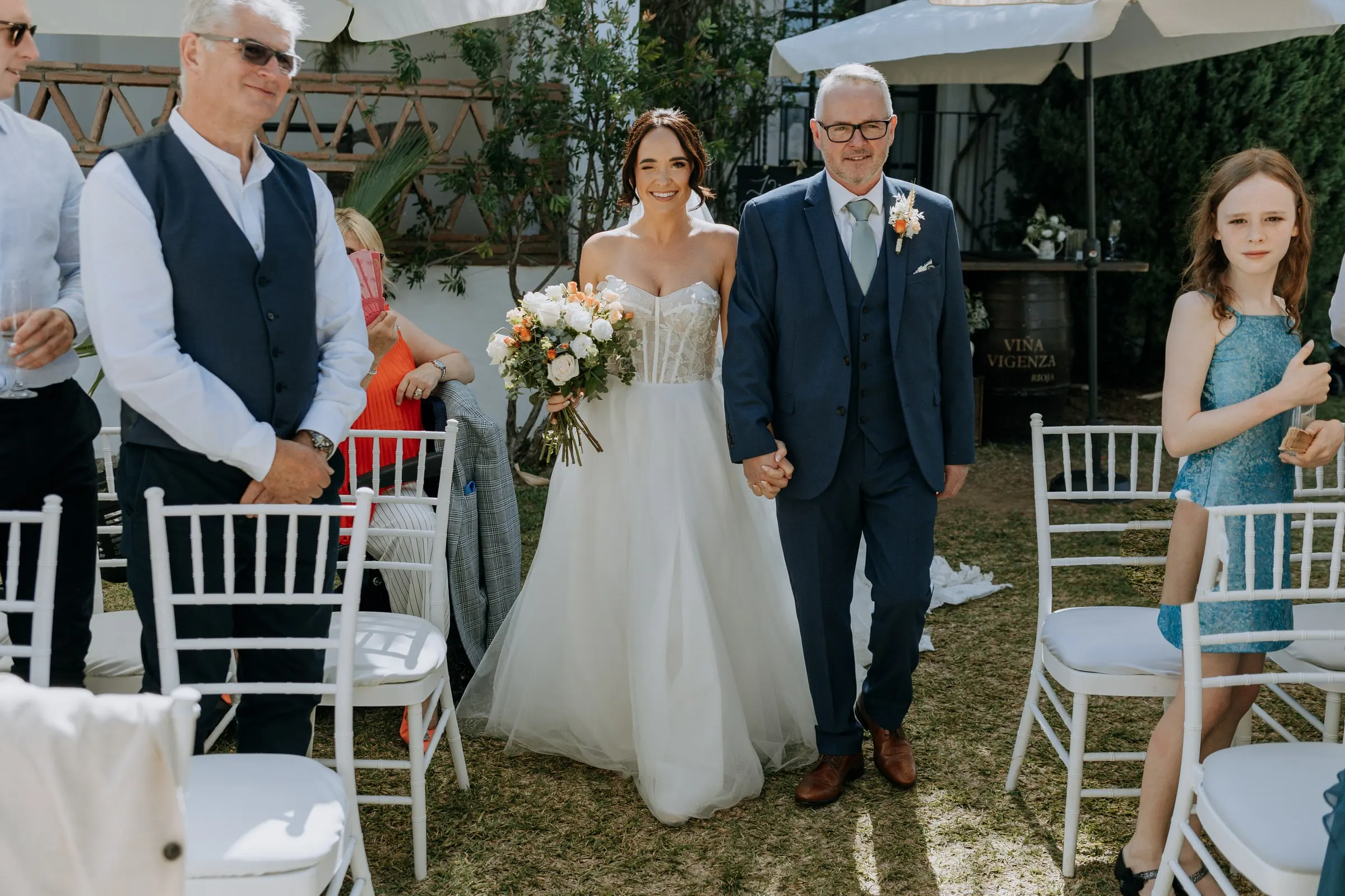 Bride walking down the aisle on her father's arm, Hacienda San José, Mijas