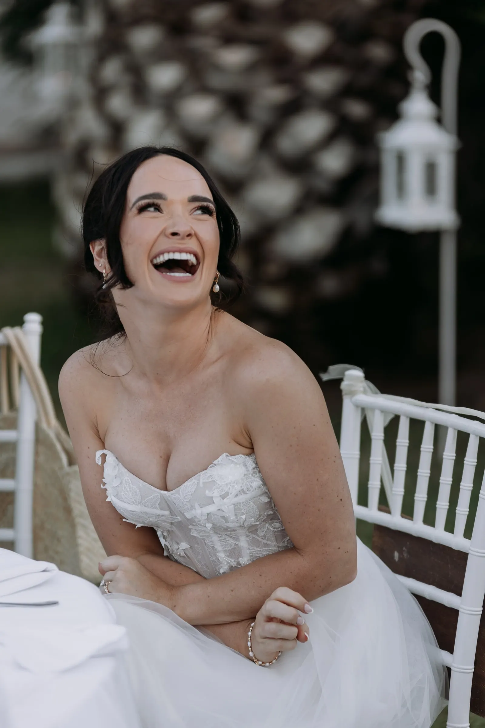 Bride laughing at the top table during the speeches, Mijas