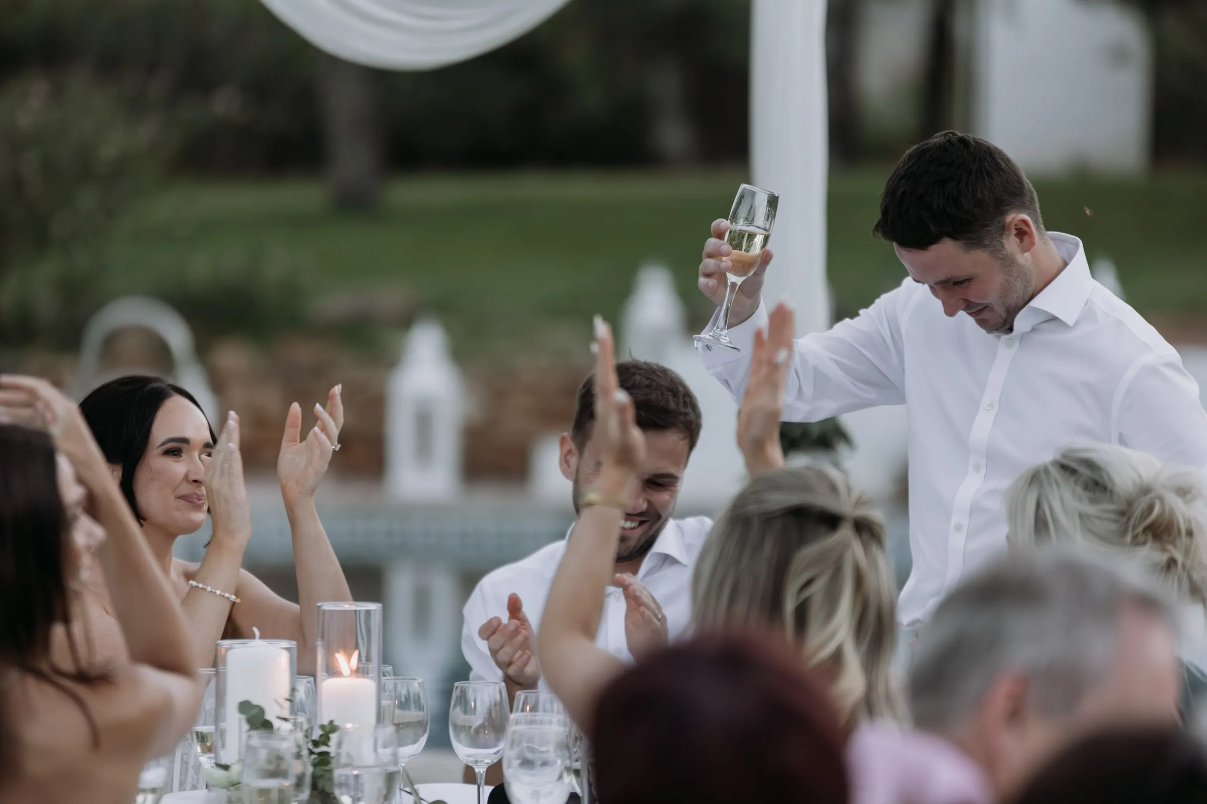 Guests applauding the end of a speech by the pool, Mijas