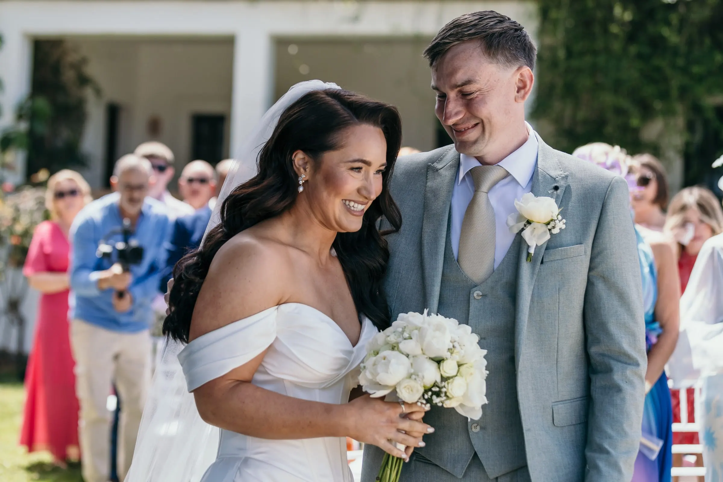 Bride and groom laughing together at the start of the ceremony, Mijas