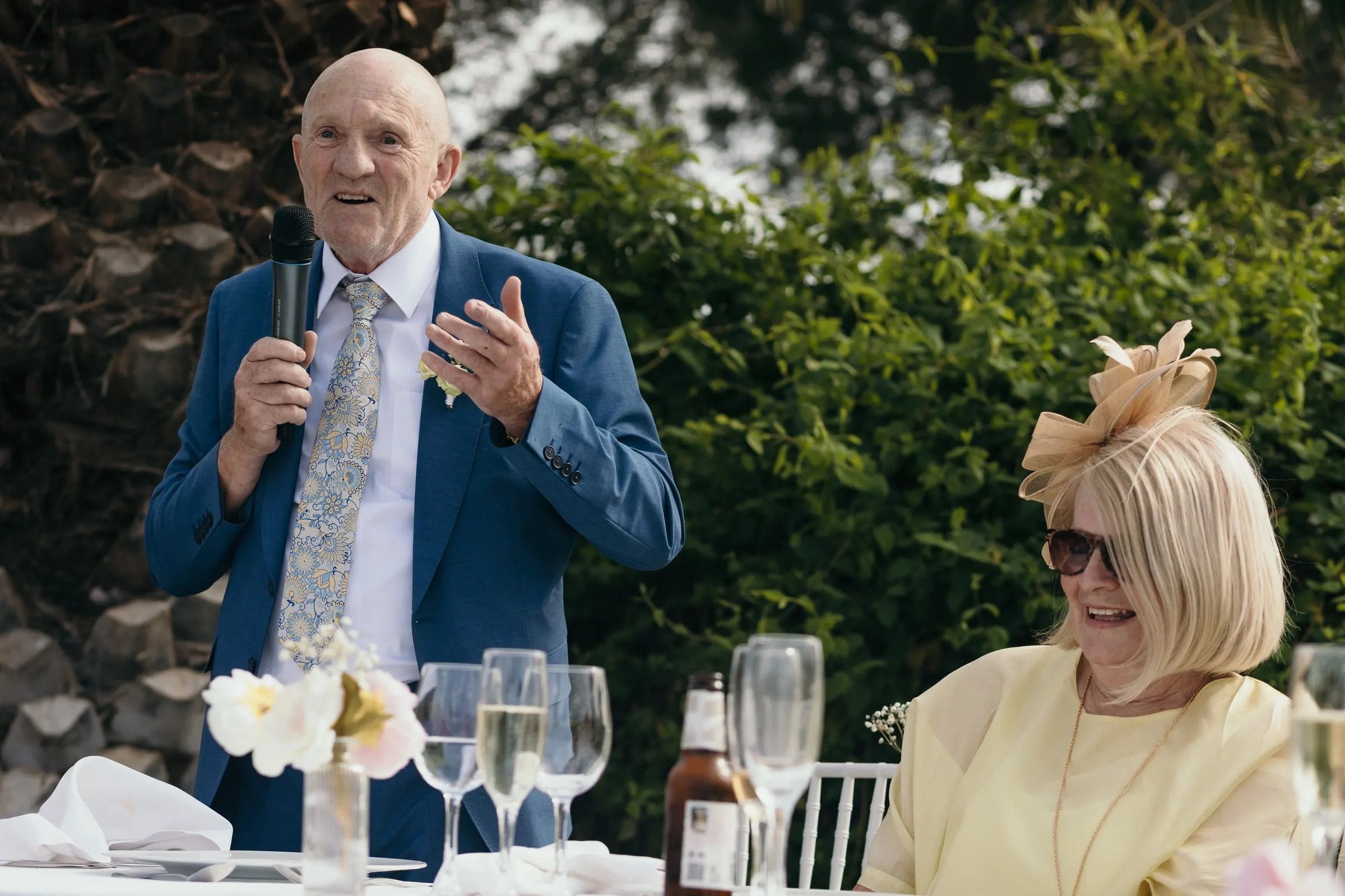 Older guest giving a speech at the top table, Hacienda San José