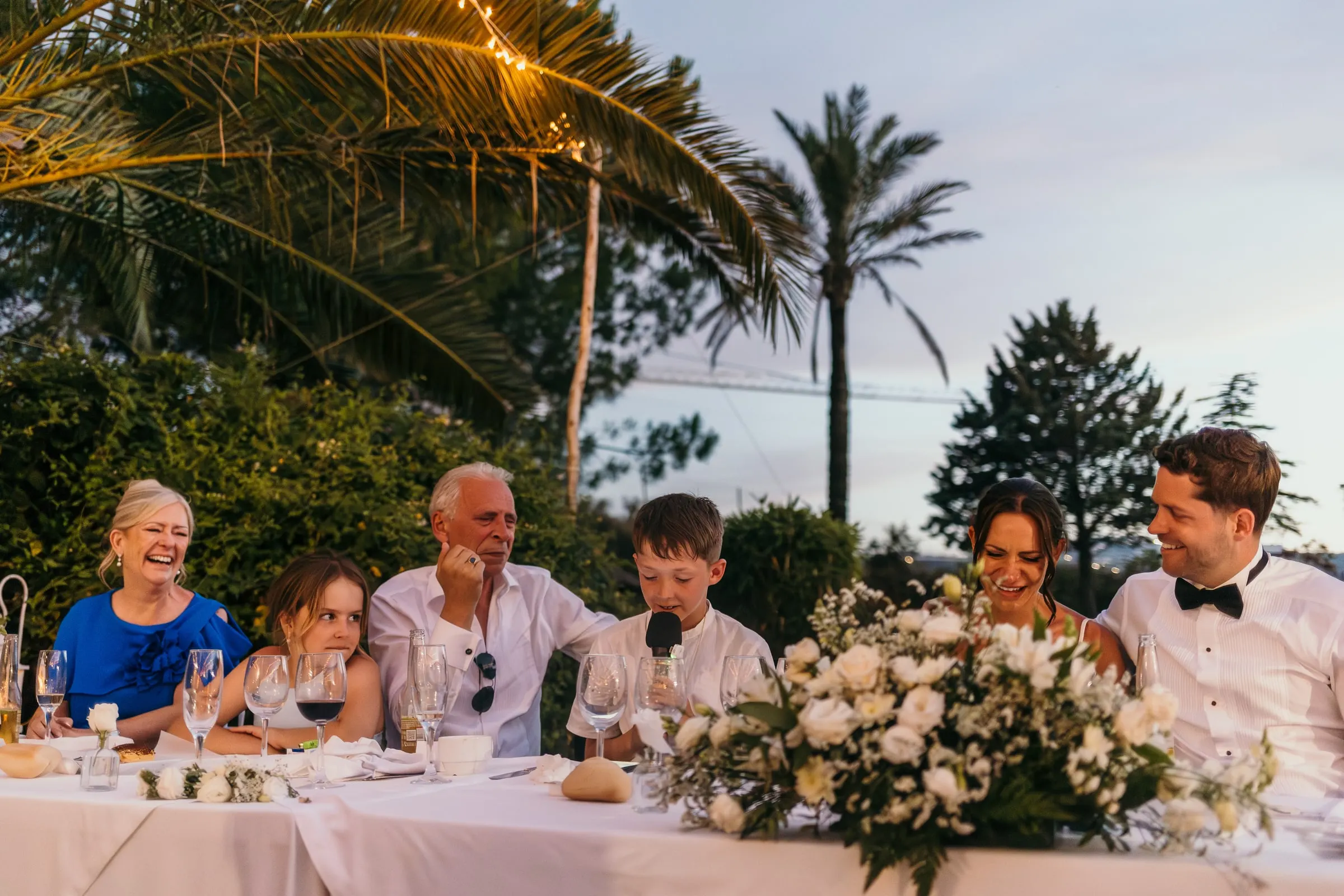 Top table lit by candles and fairy lights in the evening, Mijas