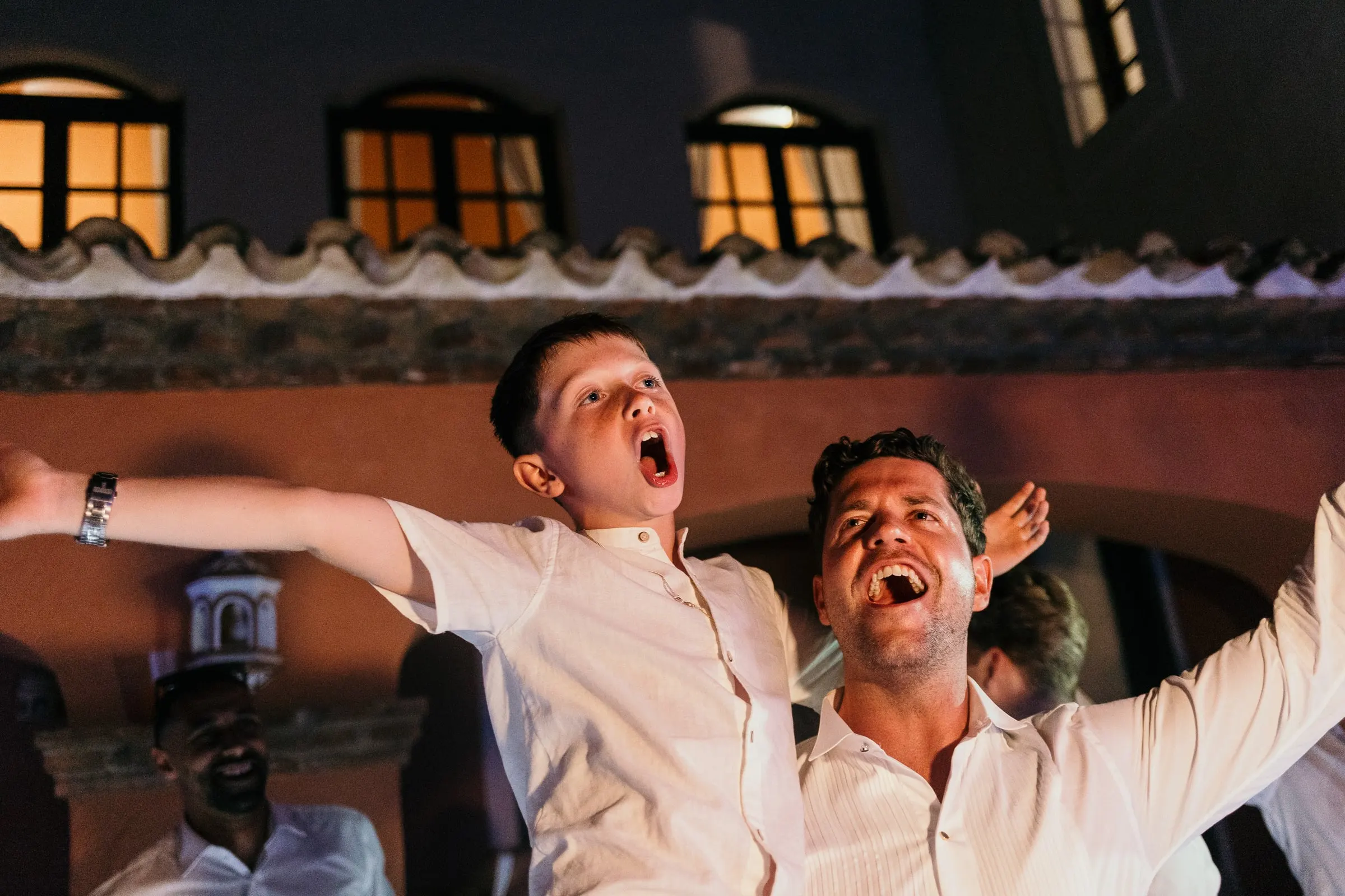 Groomsmen cheering at the wedding party in Mijas