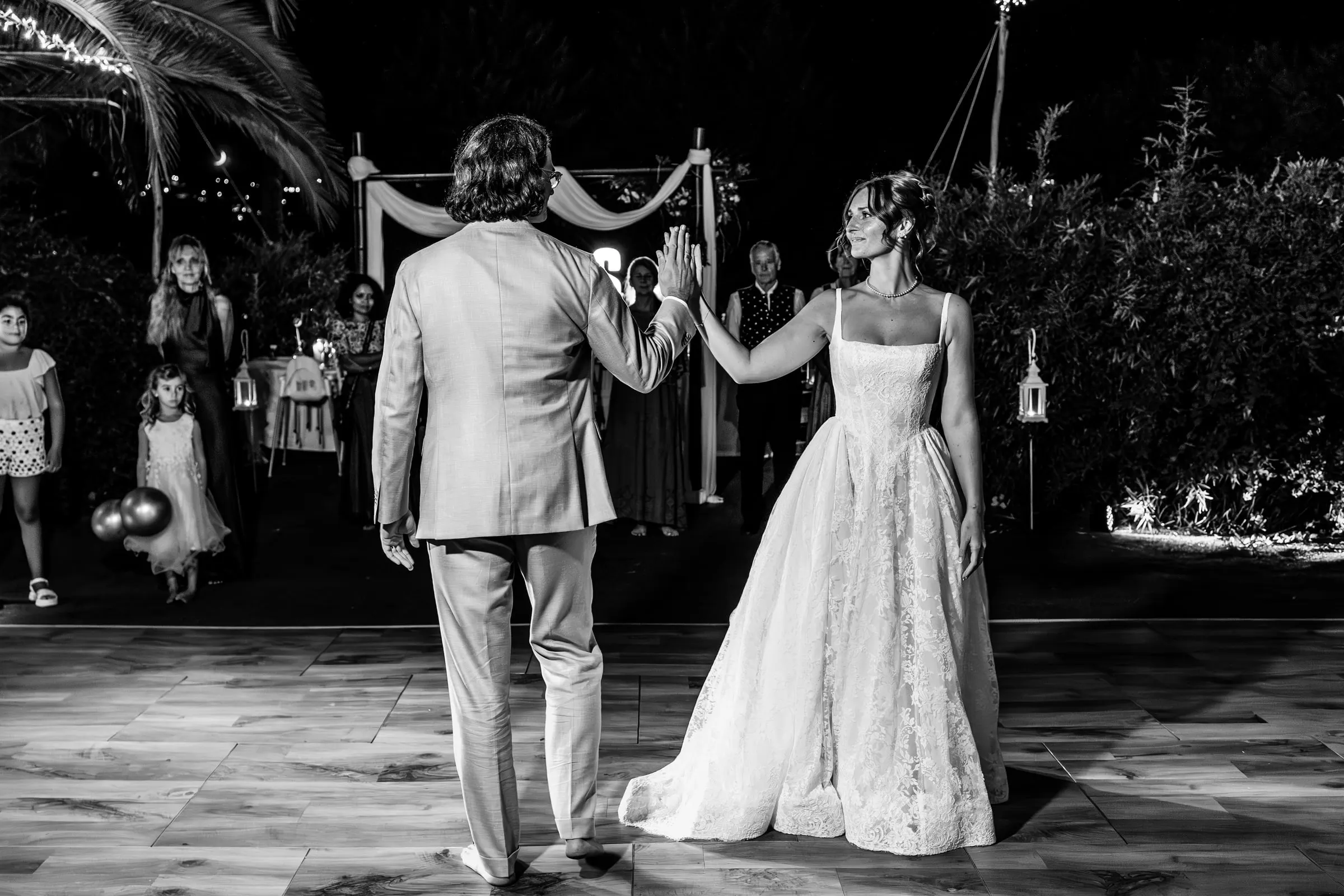 Black and white of the first dance on the outdoor dance floor at Hacienda San José, Mijas