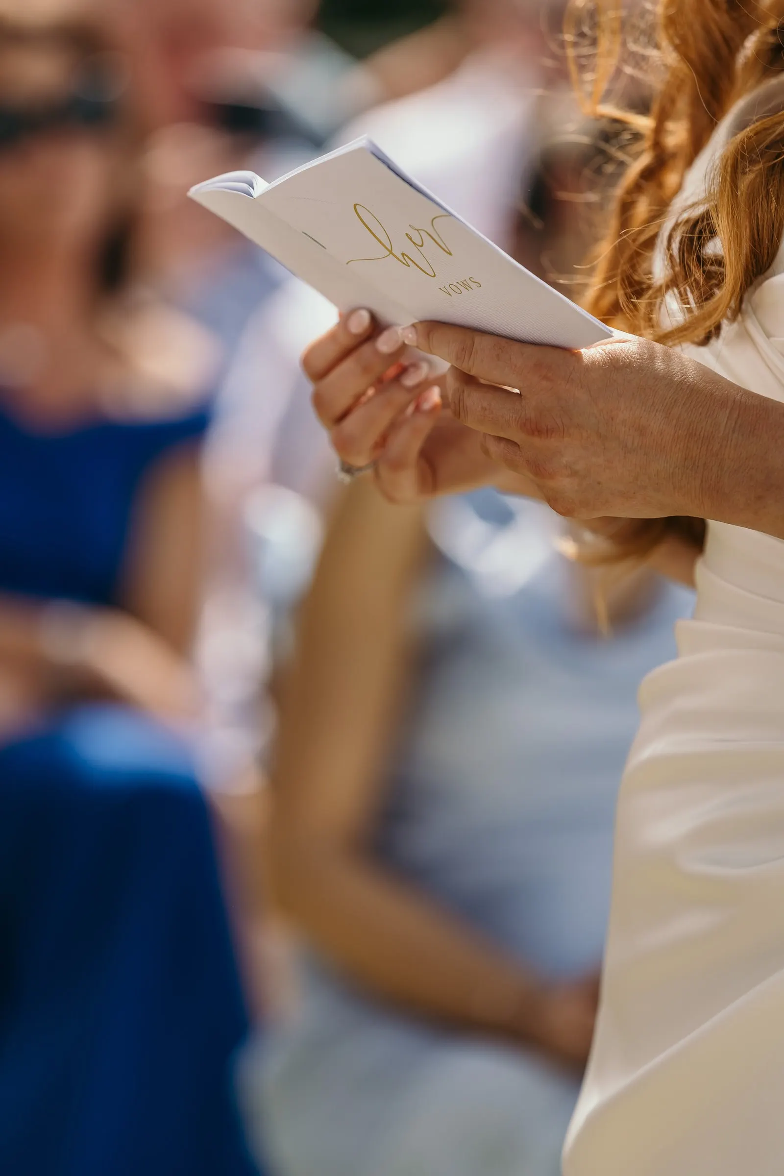 Guest reading from a small booklet during the ceremony in Mijas