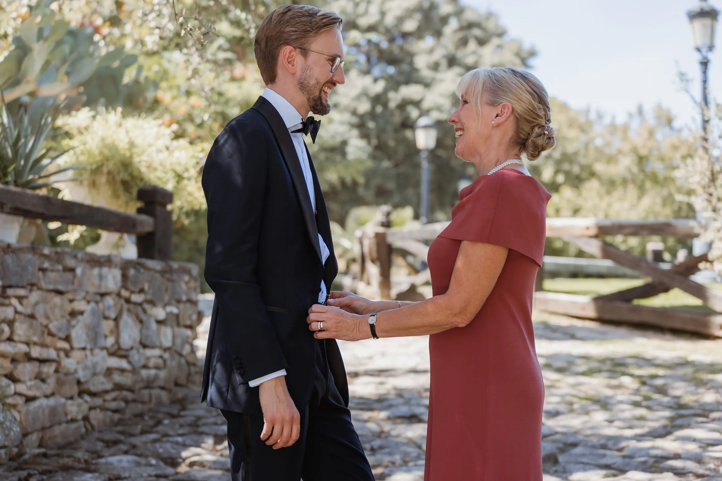 Groom greeting his mother on the cobbled path at Los Pilares de Ronda