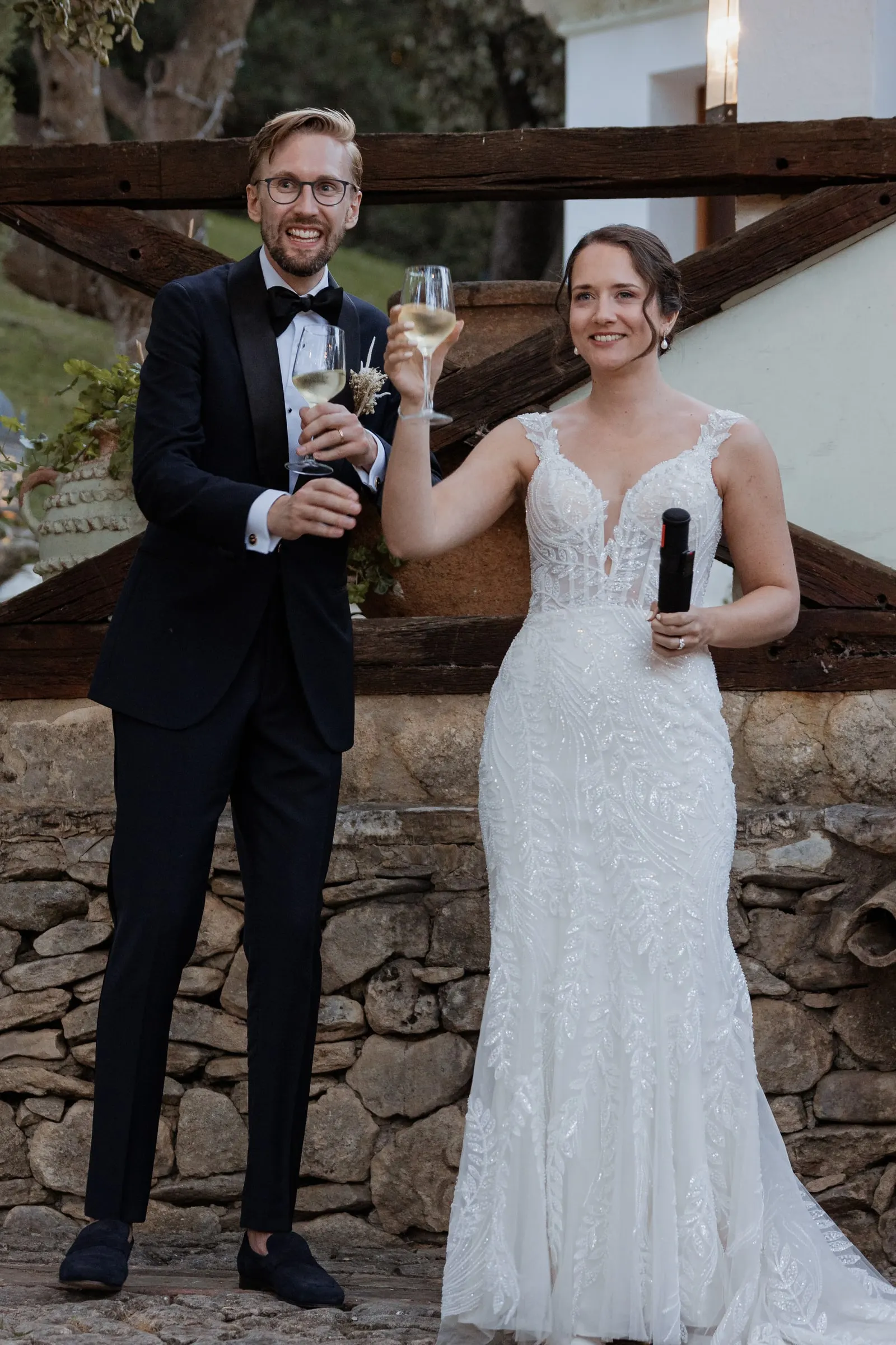 Bride and groom raising their glasses to their guests at Los Pilares de Ronda