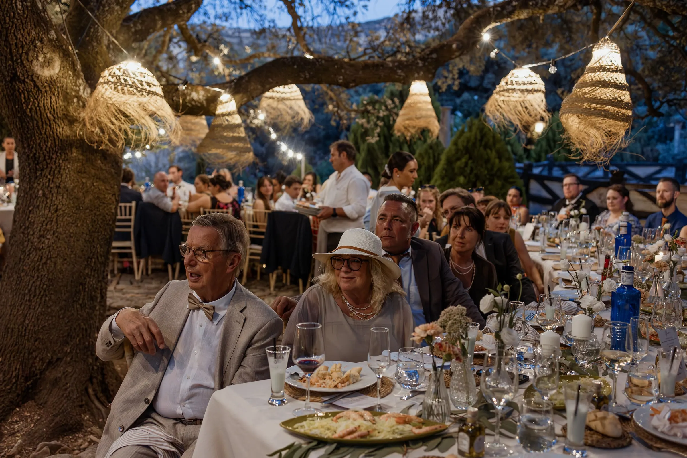 Dinner under the trees at dusk with woven lamps at Los Pilares de Ronda