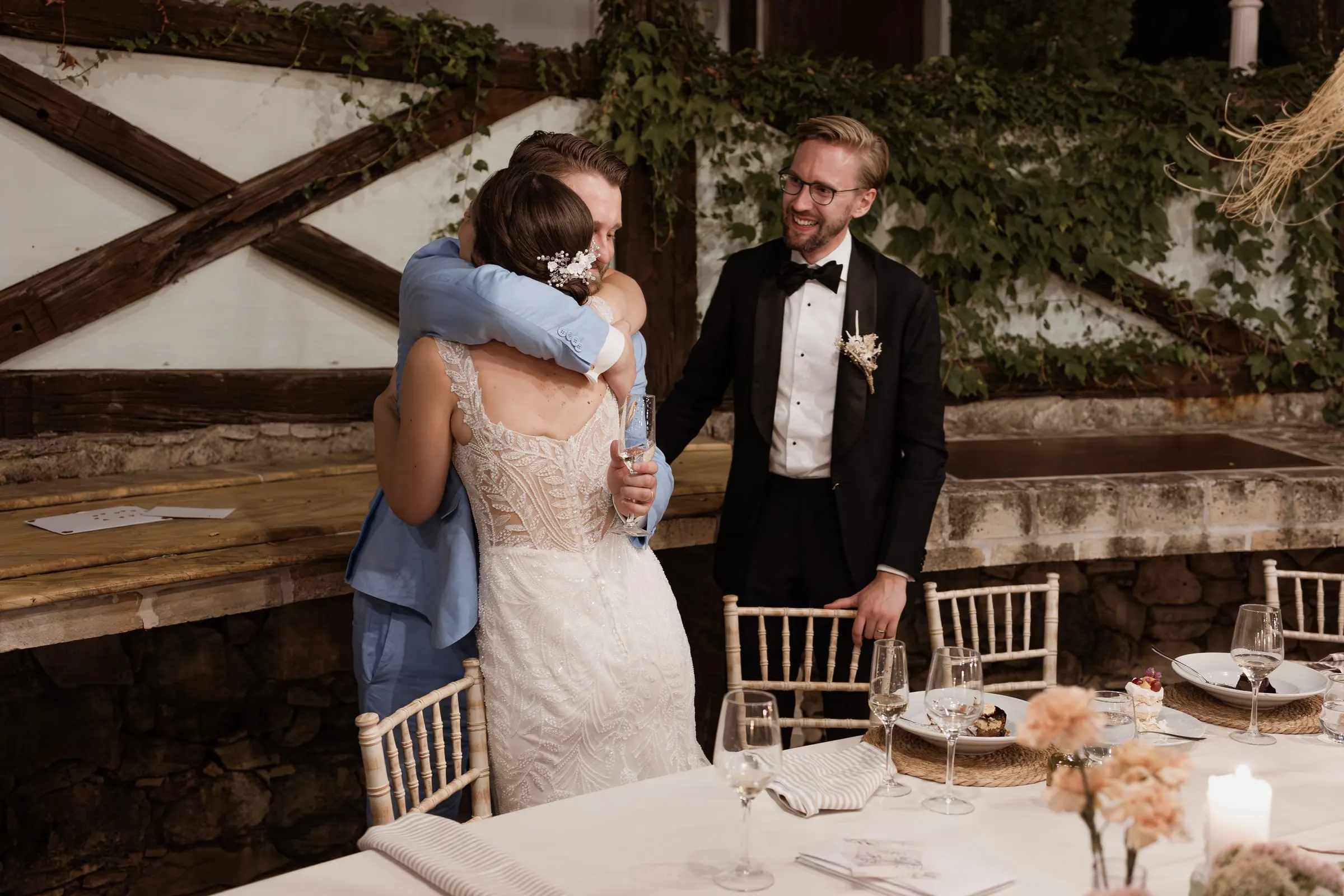 Bride hugging the best man after his speech