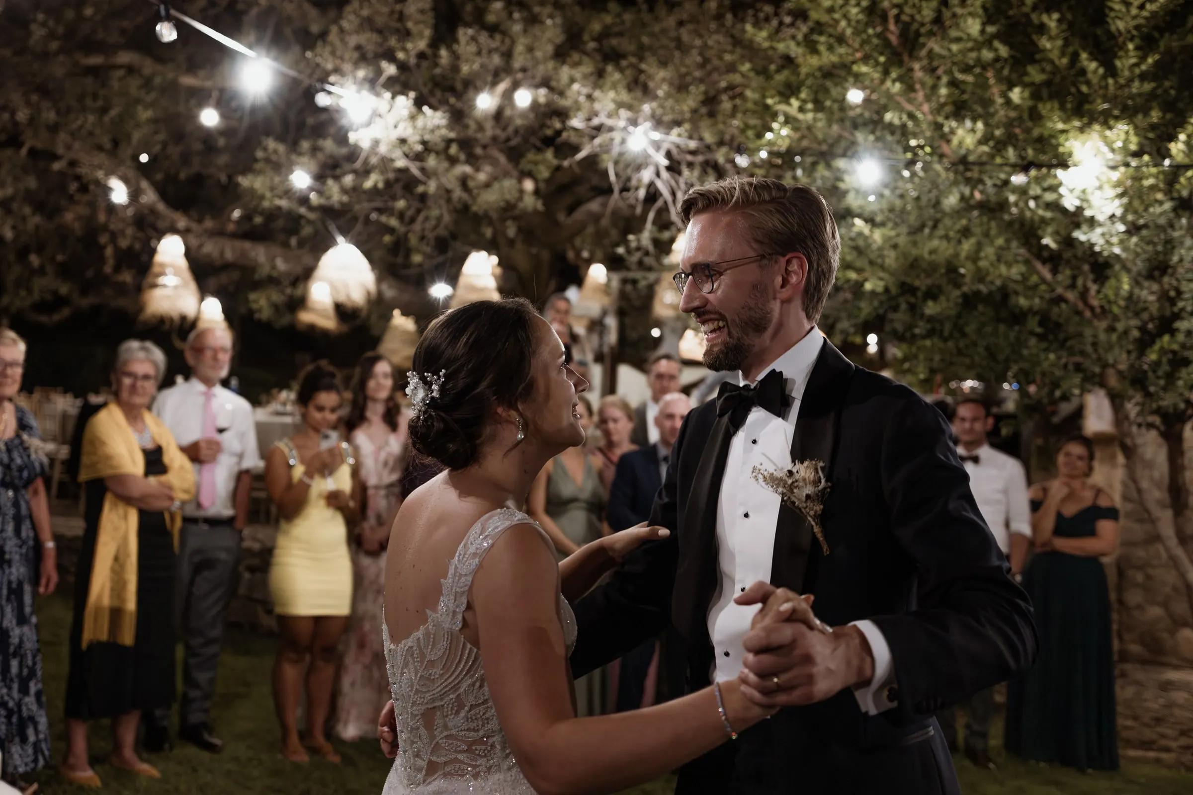 Groom spinning the bride as guests clap in the Ronda garden