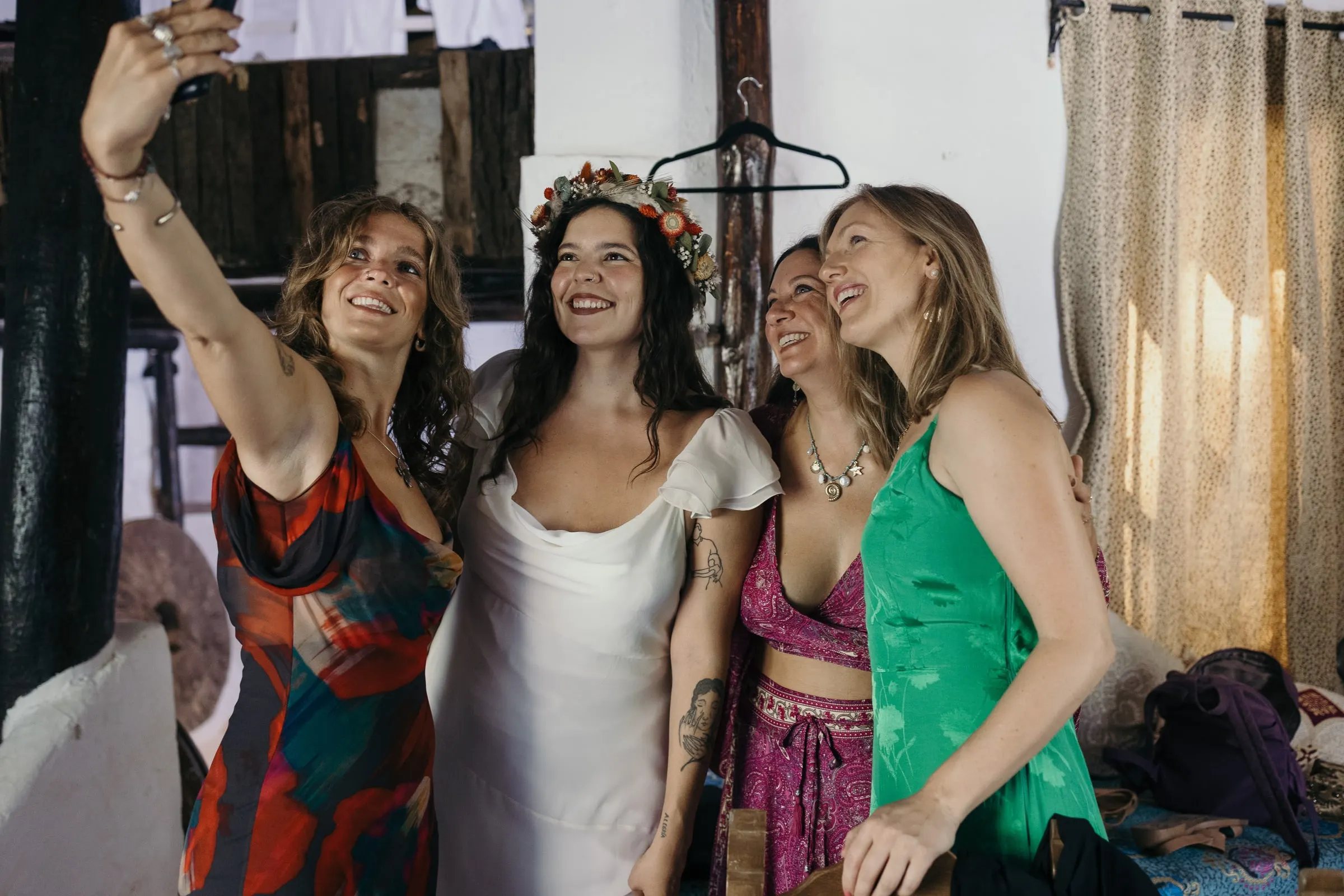 Bride taking a selfie with three friends before her wedding at Molino La Flor