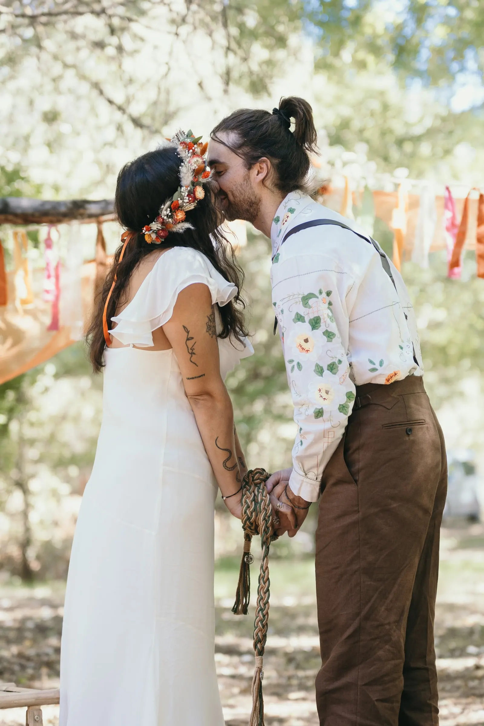First kiss after the handfasting at the woodland ceremony
