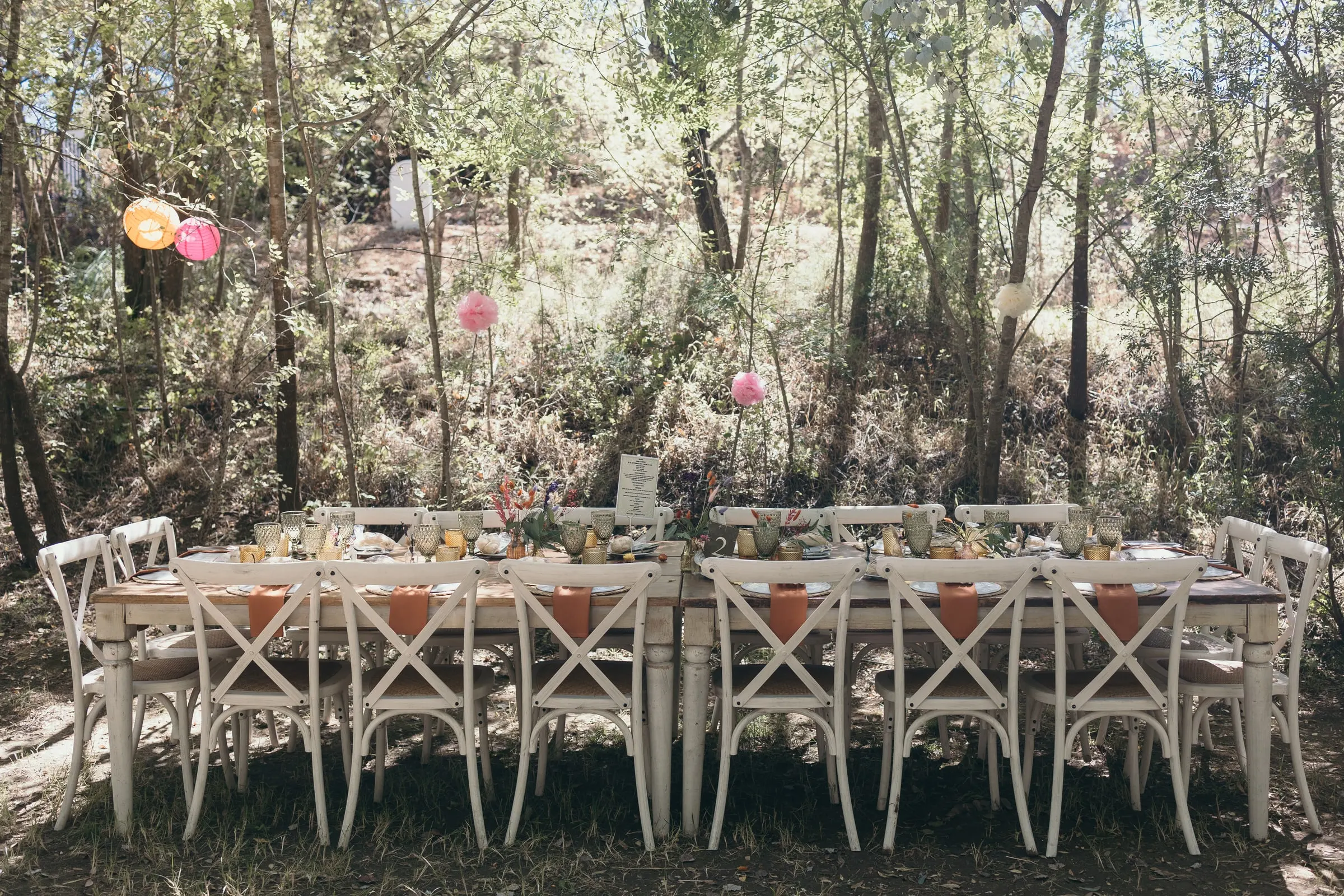 Wedding tables set among the trees of the Guadiaro valley at Molino La Flor