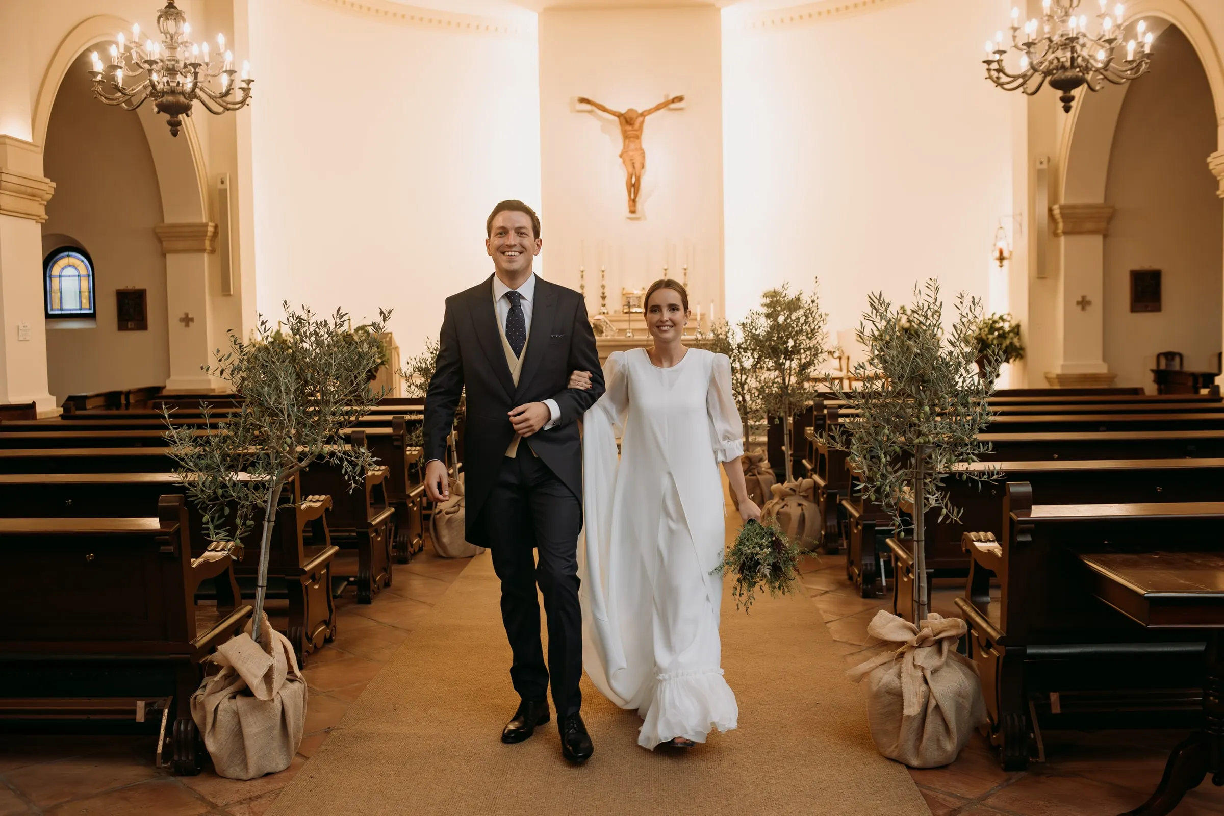 Newlyweds walking back down the aisle as husband and wife