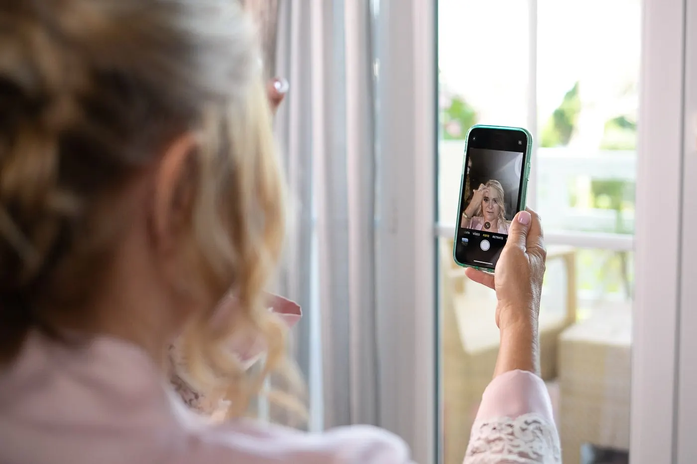 Guest taking a selfie by the balcony door
