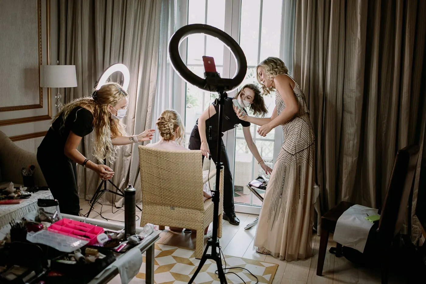 The suite busy with hair, make-up and friends getting ready