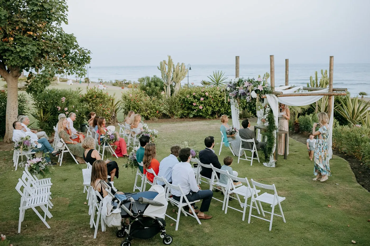 Wide view of the ceremony on the lawn above the sea, Tikitano, Estepona