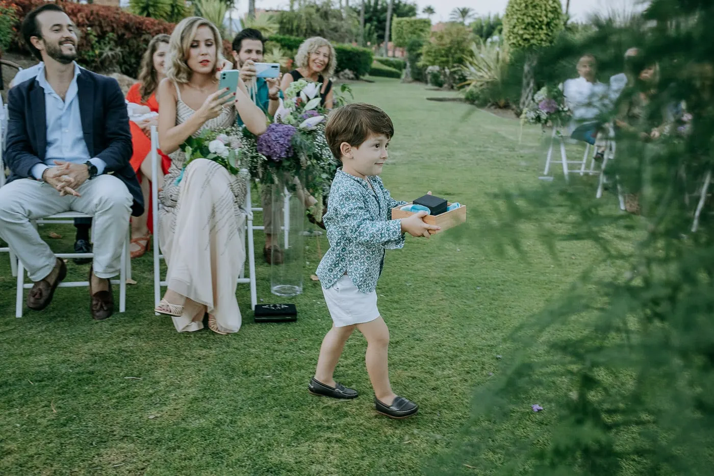 Little boy carrying the rings up the aisle, Tikitano