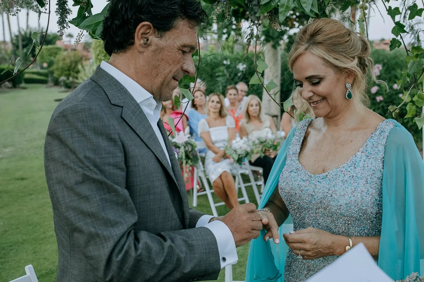Groom putting the ring on the bride's finger, Estepona