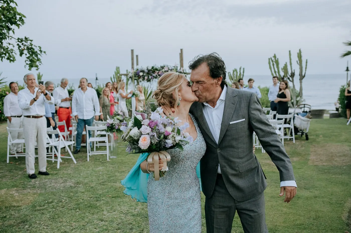 Bride kissing the groom on the cheek after the ceremony